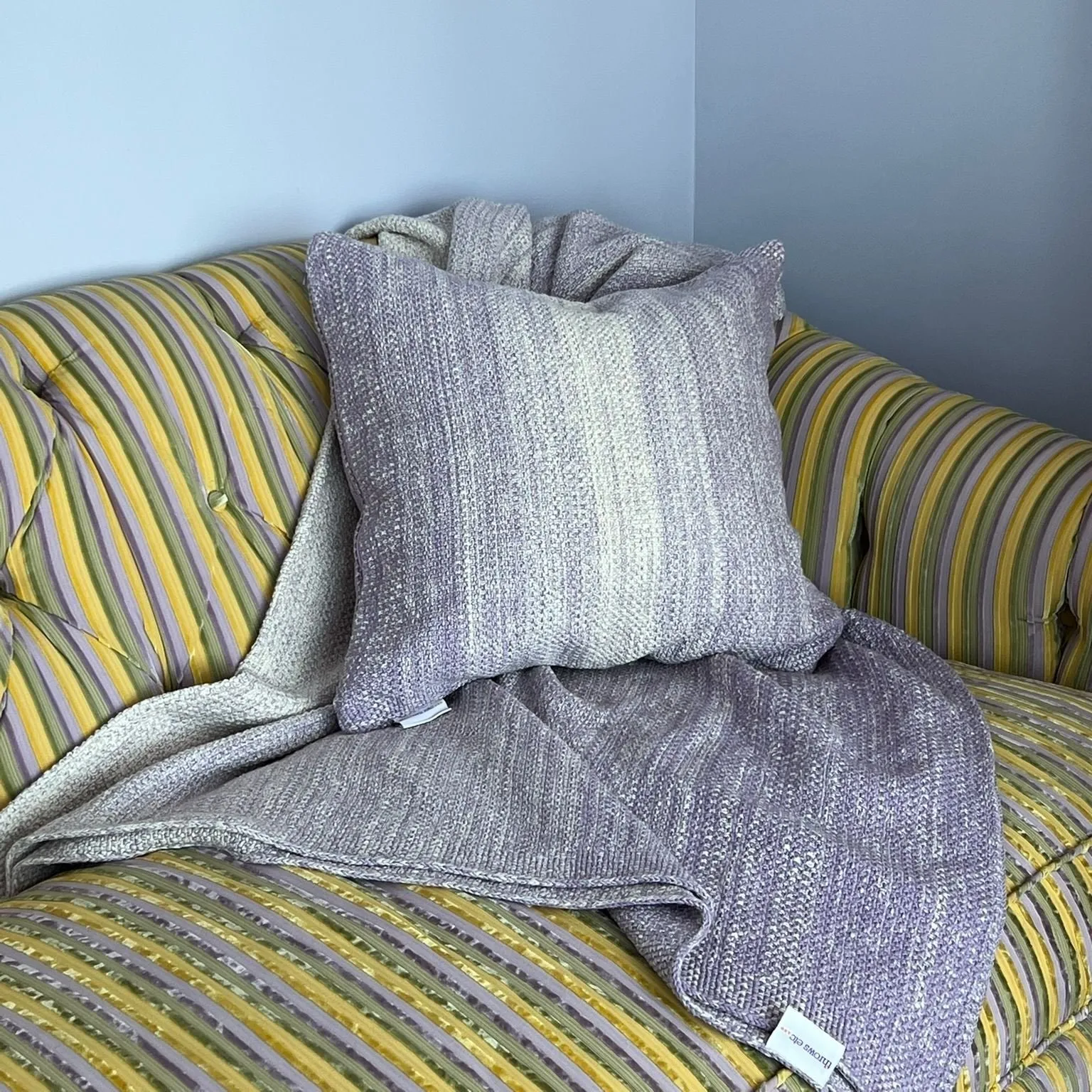 purple knitted throw and throw pillow set